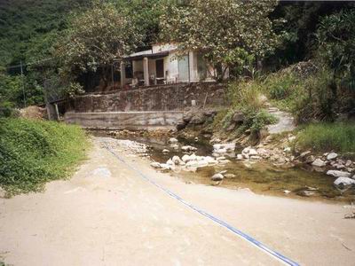 The unsewered hinterland of Big Wave Bay is still a potential pollution source for the beach