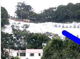 Cover up of exposed earth with impervious plastic sheets followed by hydroseeding effectively prevented the emission of fugitive dust and discharge of muddy water.