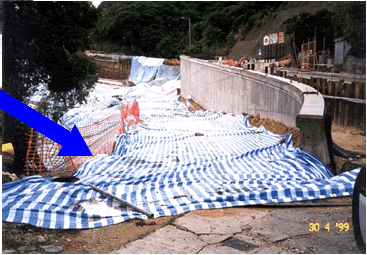 Cover up of exposed earth with impervious plastic sheets followed by hydroseeding effectively prevented the emission of fugitive dust and discharge of muddy water.