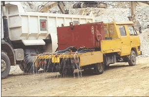 Water trucks to maintain main haul road wet.