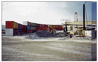Noise from stockpile screened with barrier constructed of containers