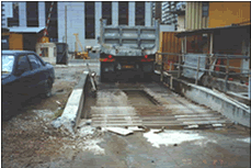 Vehicle is washed by high-pressure water jet at wheel washing bay and the wastewater is recycled 