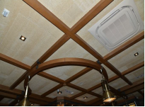 Ceiling in seating areas mounted with sound insulation panels