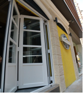 Double-glazing door to reduce noise transmission to outside of the bar