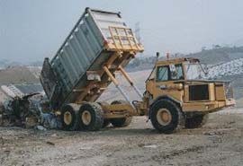 Image of Waste Truck Unloads at the Tipping Face