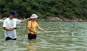 Environment Protection Department's inspectors collect beach water sample