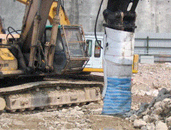 Wrap excavator-mounted hydraulic breaker with noise absorbent