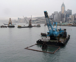 Silt curtain hanged on closed metal frame to confine the suspension of sediment from marine dredging work