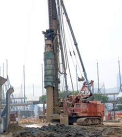 Wrap piling rig with retractable impervious tube