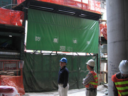 Roll down dust screen at site entrance