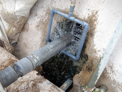 Mist shield to suppress dust emission during drilling for soil nail