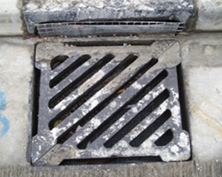 Gully protected with wire mesh to avoid blockage of drainage system