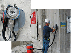 The grinding machine is attached to a vacuum cleaner for effective dust control during grinding operation.