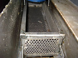 Screening device is installed in the inlet pipe of the grease trap and the trapped solid waste is collected and disposed as general refuse daily.